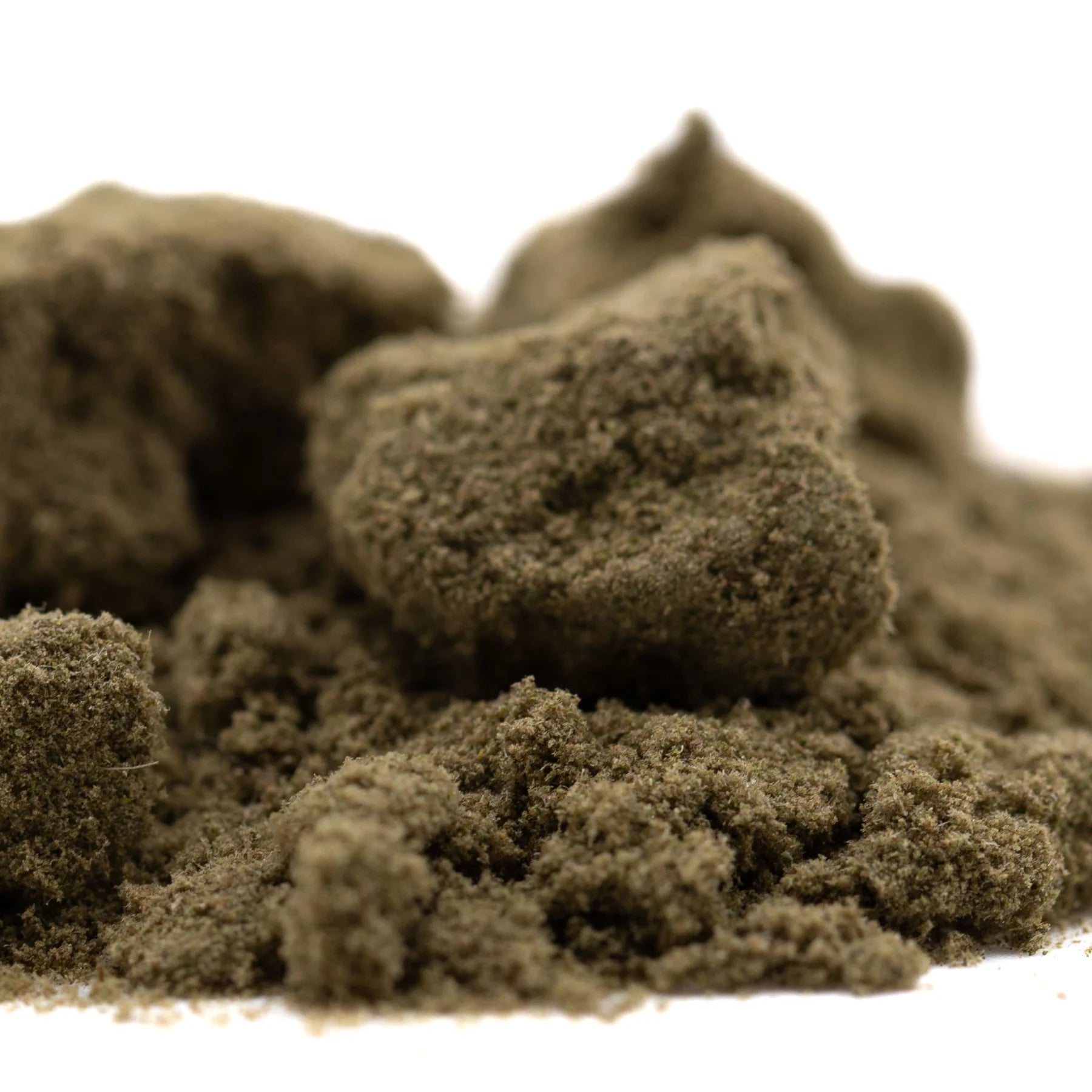 A mound of earthy brown textured thca kief granules from durban poison for living cannabis use