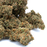 Early blossom cbd hemp flower showcasing green and orange buds with dense frosty texture and cannabidiol potency