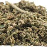 A pile of early blossom full-term cbd trim hemp flower buds in green brown and beige hues for auto tsunami use