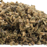 A pile of elektra full-term cbd hemp flower trim in green brown and tan hues highlighting its terpene profile
