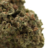 Emerald fire thca flower dense green bud with fine trichomes and brown pistils ideal for sour lemon-lime social enhancement