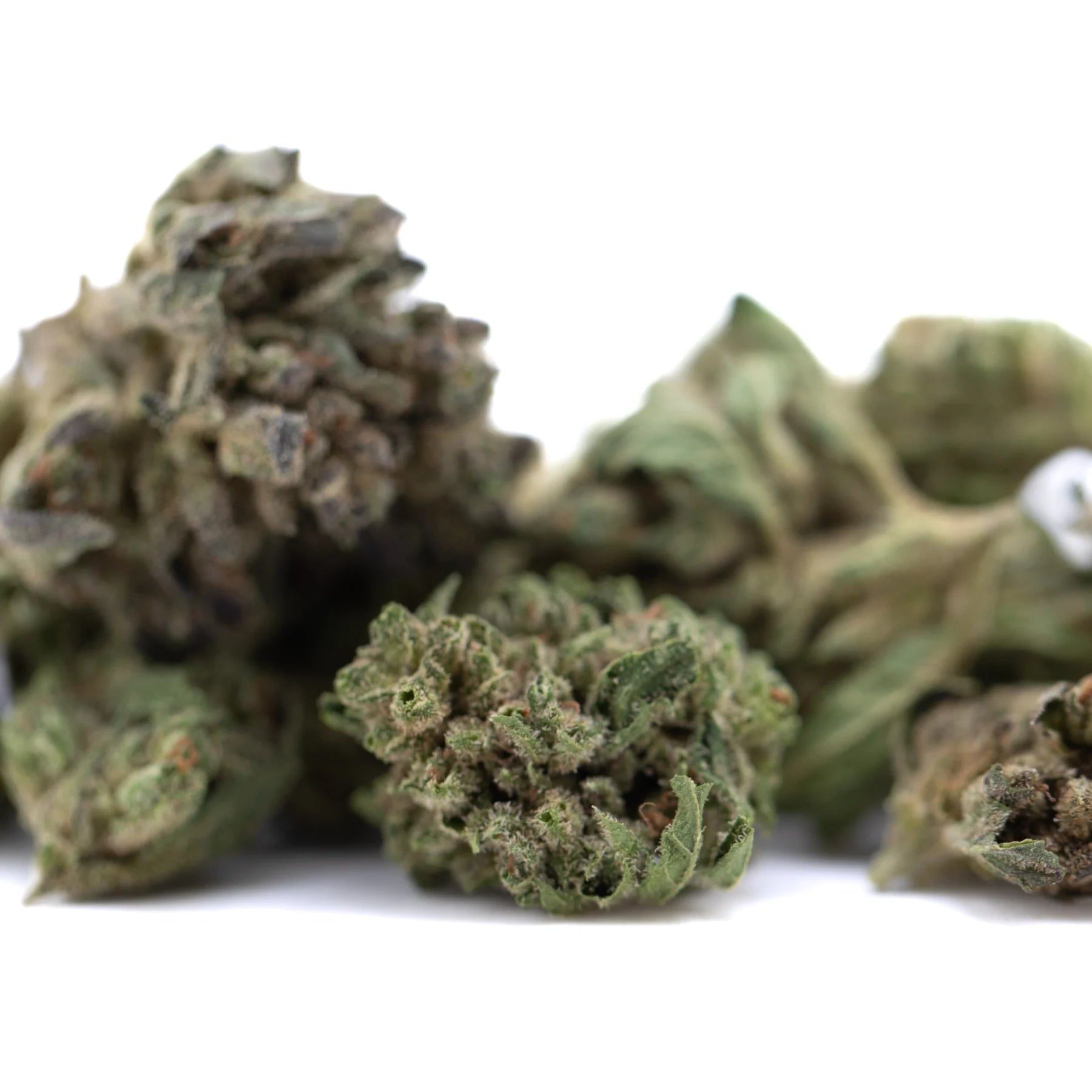 Dried emerald fire’s full-term thca flower smalls with dense textured buds in greenish brown hues