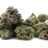 Dried emerald fire’s full-term thca flower smalls with dense textured buds in greenish brown hues