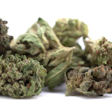 Dried emerald fire’s full-term thca flower smalls with green and brown hues covered in fine trichomes