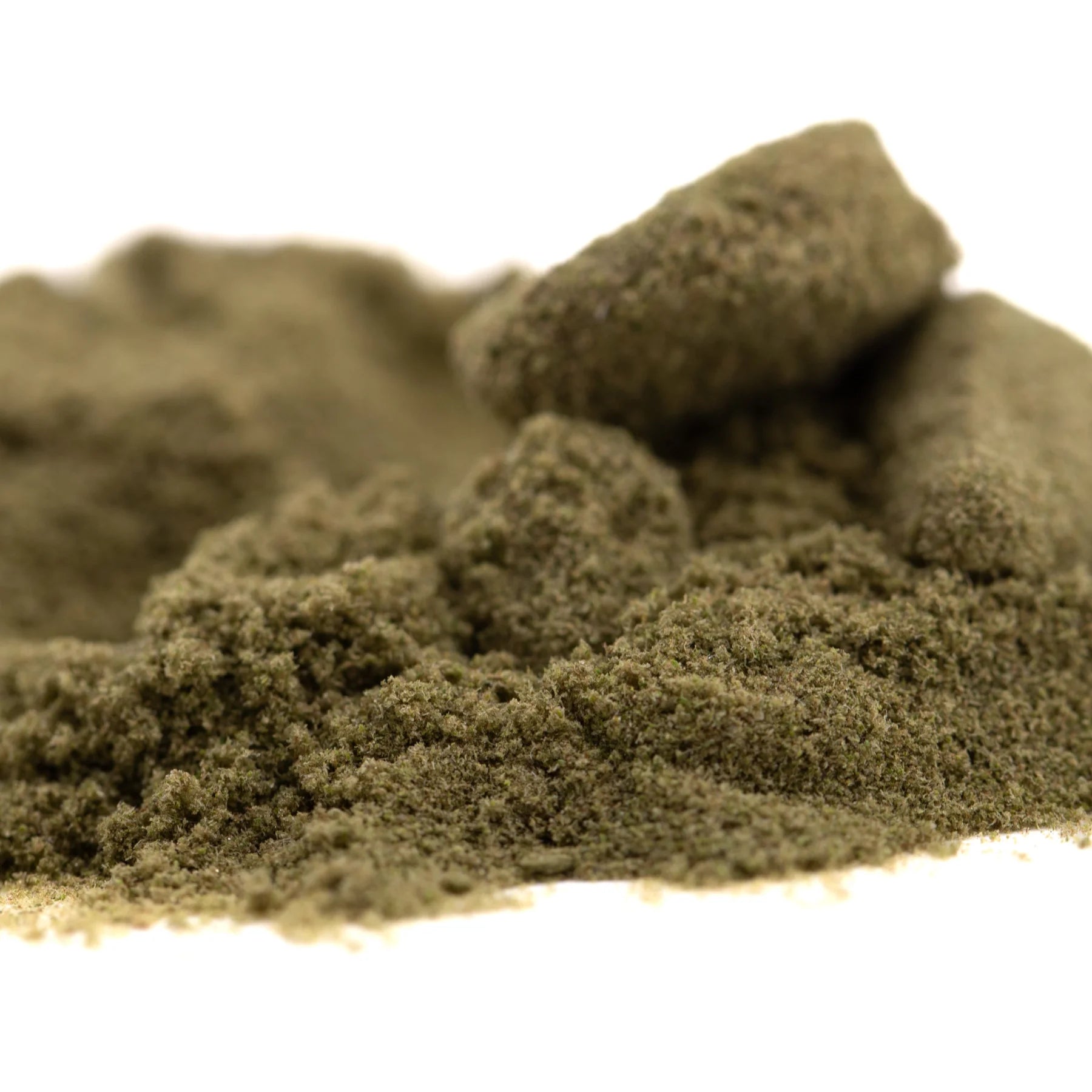 A mound of dark olive-green thca kief full-term powder by dark heart nursery with sour lemon-lime notes