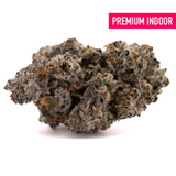 Dense frosty Fire OG THCa Indoor Flower with dark green, purple hues and orange pistils