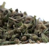 A pile of dried greenish-brown fog dog trim thca trim hemp flower buds with visible trichomes and fuzzy texture