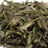 Dried green tea leaves with mixed shades and stems for fornicate greenhouse thca trim wholesale obama kush cultivation