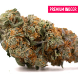 Frosted Flakes Indoor THCa Flower with dense trichome-rich buds and vibrant orange pistils