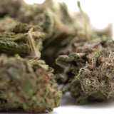Green and purple gas monkey greenhouse smalls hemp flower buds with frosty thca content and textured surface