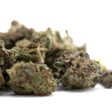 A pile of gas monkey thca greenhouse smalls hemp flower buds in green brown and purple hues showing high thca content