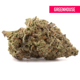 A dense greenhouse thca cannabis bud with kush genetics featuring green brown hues and substantial potency trichomes