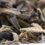 Dried sage leaves with a fuzzy light green and brown texture in gassa purple’s greenhouse thca trim wholesale product