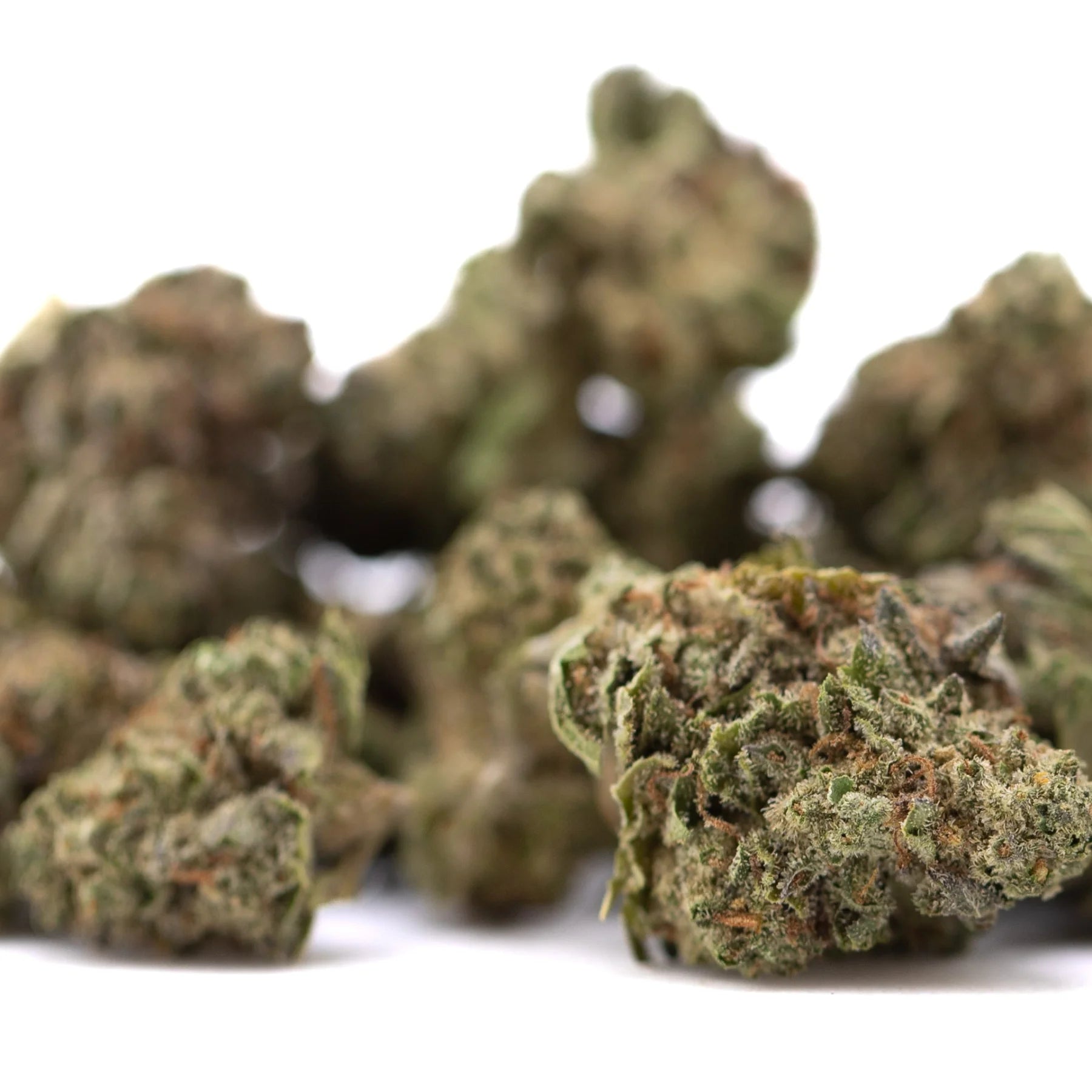 Gelato thca greenhouse smalls featuring dense frosty green and brown cannabis buds with gelato thca and sunset sherbet notes