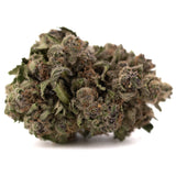 A dense green and brown greenhouse thca flower with frosty textured surface premium hemp makes giggle gas