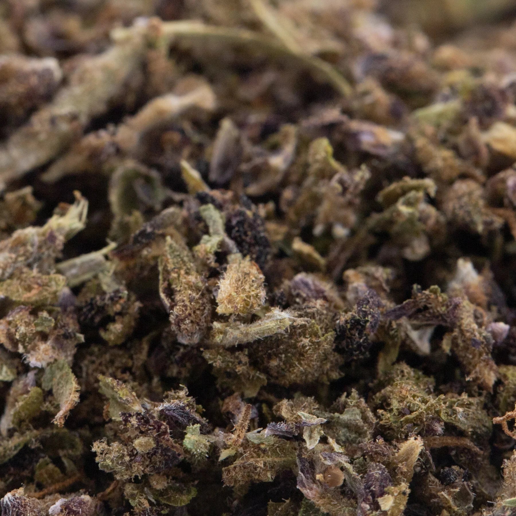 Dried glue full-term cbd trim hemp flower trim buds with green brown and purple hues for herbal use