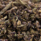 Dried glue full-term cbd trim hemp flower trim buds with green brown and purple hues for herbal use