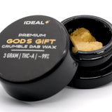 Open black container of Gods Gift 94.67 THCa crumble dab wax showing crumble wax product