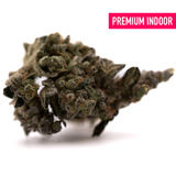 Dense crystalline Green Crack Indoor THCa Flower with dark green and purple hues