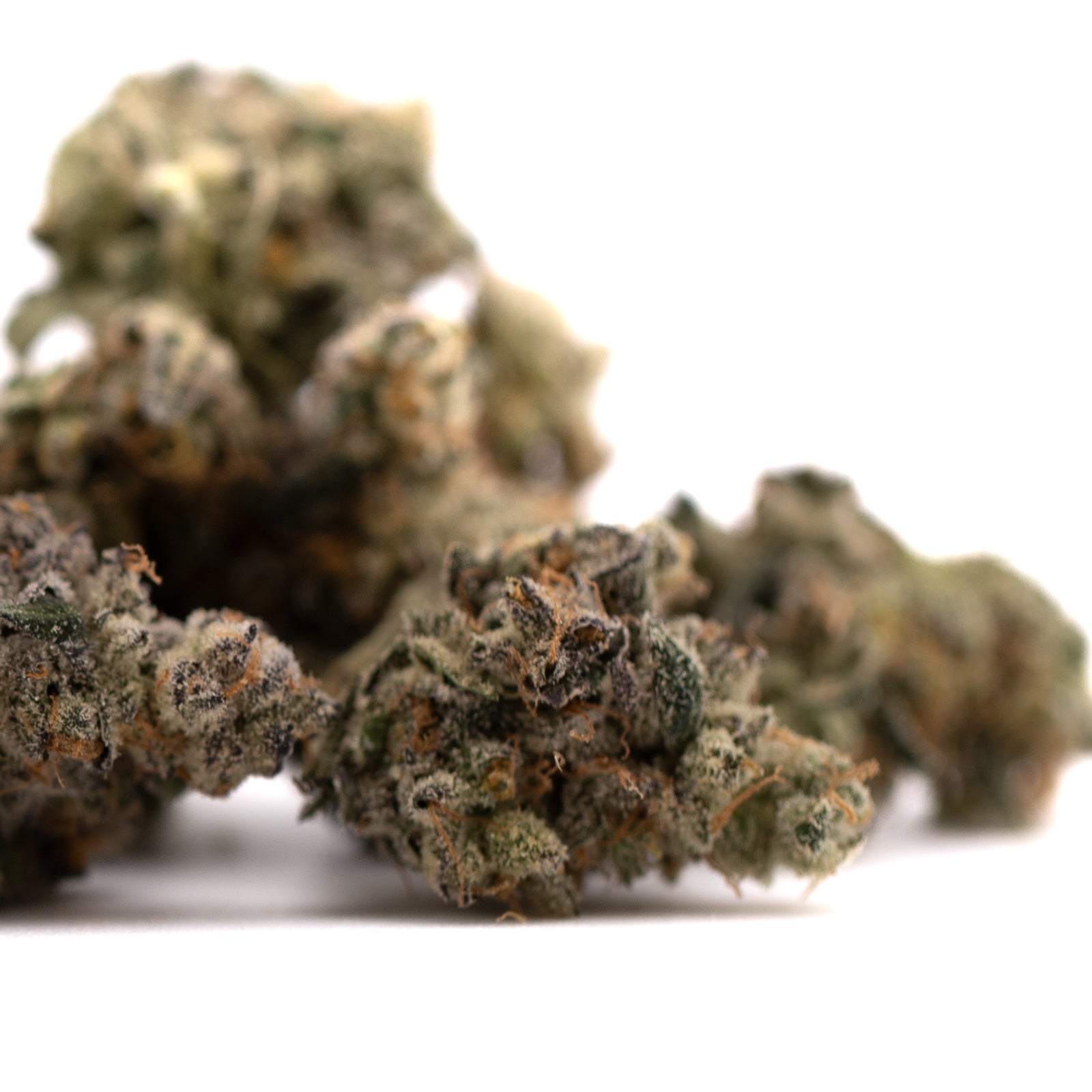 Dried Green Crack Indoor THCa Flower buds with rich trichomes and green purple hues