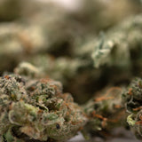 Dried Guava Z Indoor THCa Flower Smalls with trichomes and orange pistils