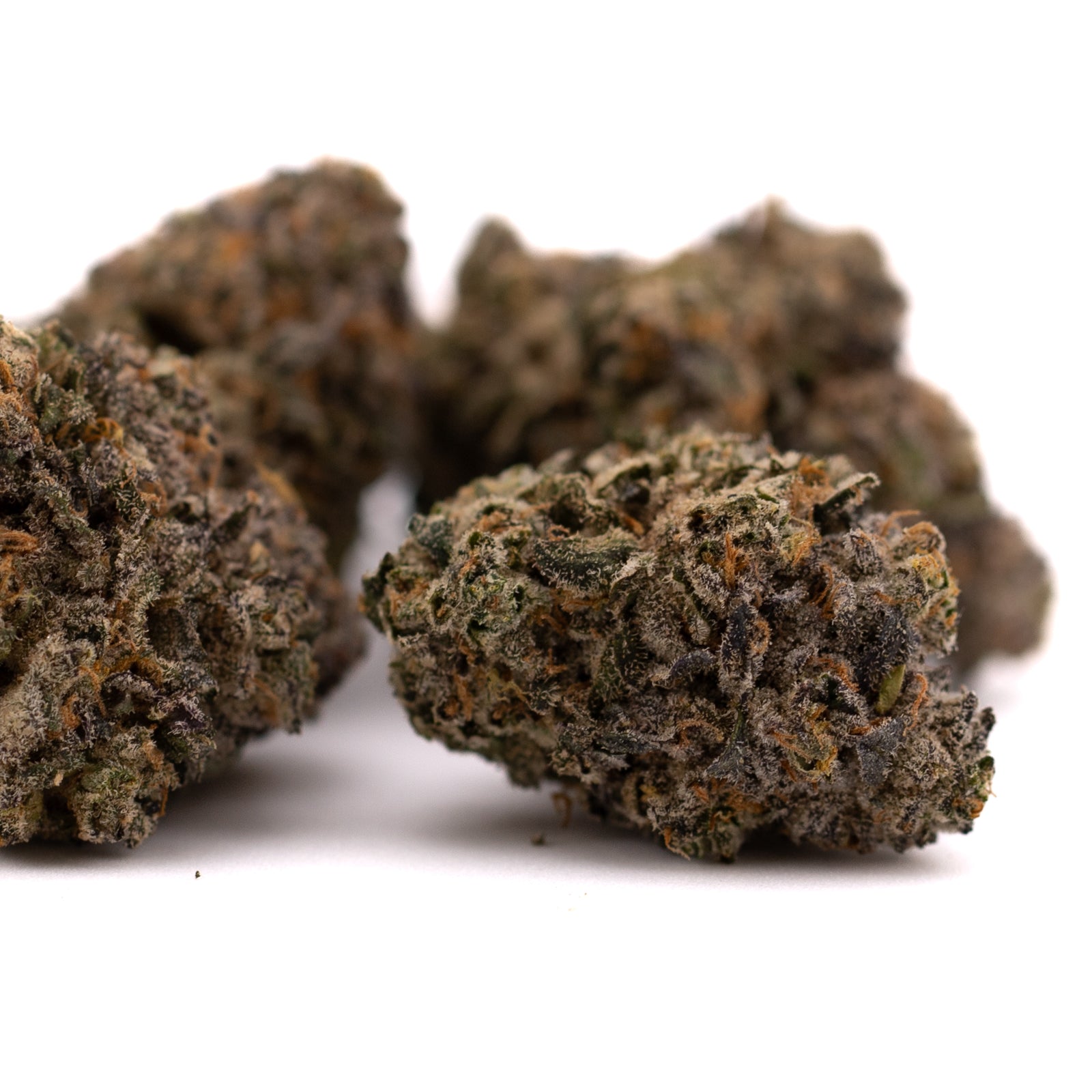 Premium Highlighter THCa Indoor Flower with purple and orange hues showcasing Orchard Swirl Synergy and Bubble Bath effects