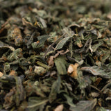 Close-up of dried green herbs with trichome coverage from Purple City Genetics indoor THCa trim