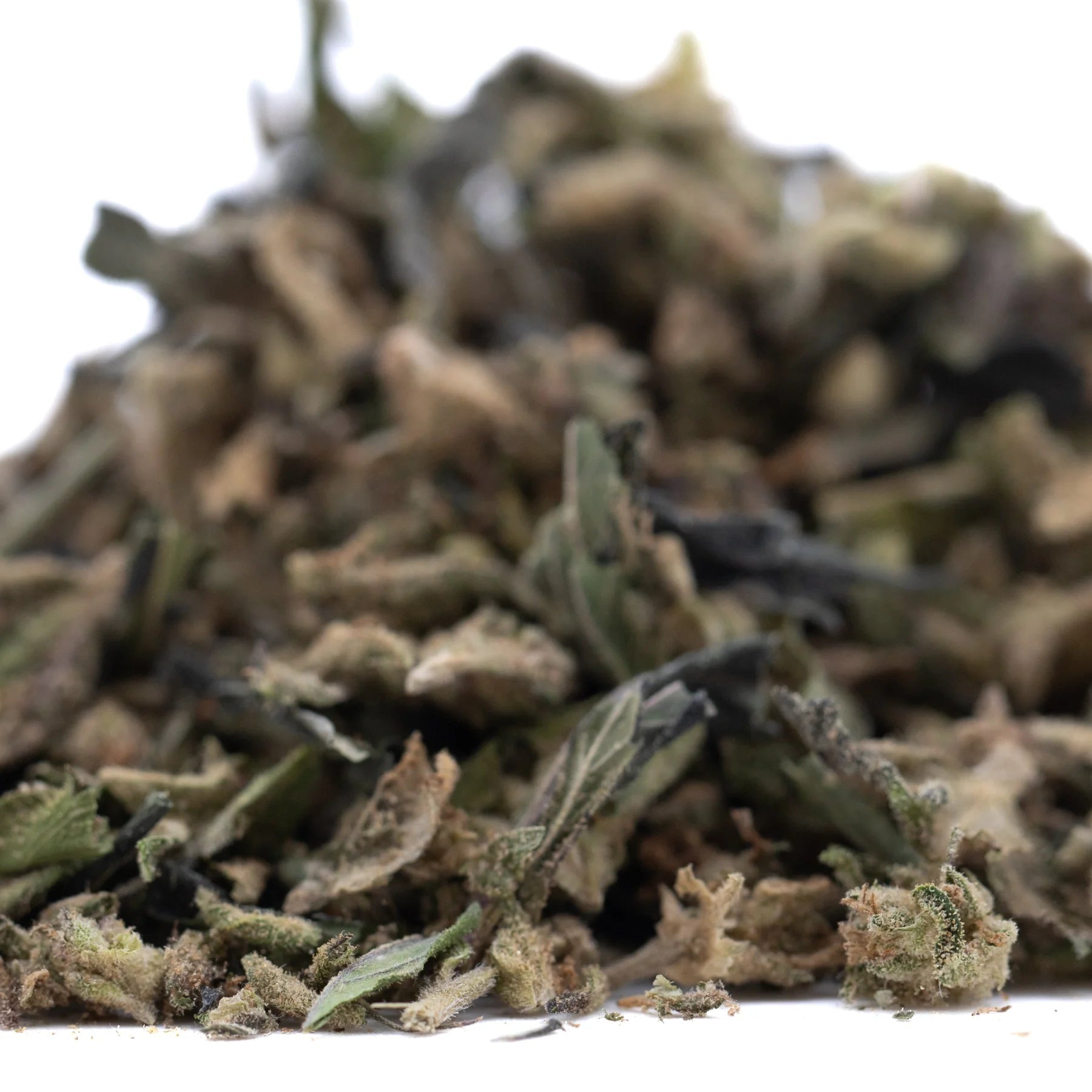 A pile of ice cream full-term thca flower buds with green and brown hues showing trichomes and terpene profile from indoor cultivation