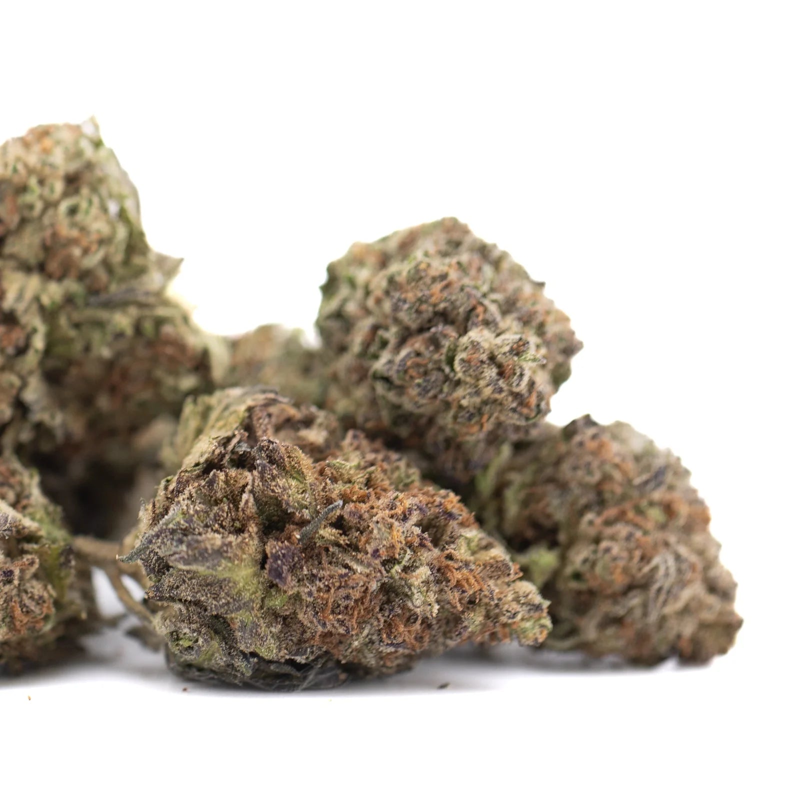 Dried jealousy greenhouse thca hemp flower buds with dense textured surface in green brown and purple for mental stimulation