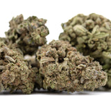 Jelly Donut THCa hemp flower buds with green hues and trichomes