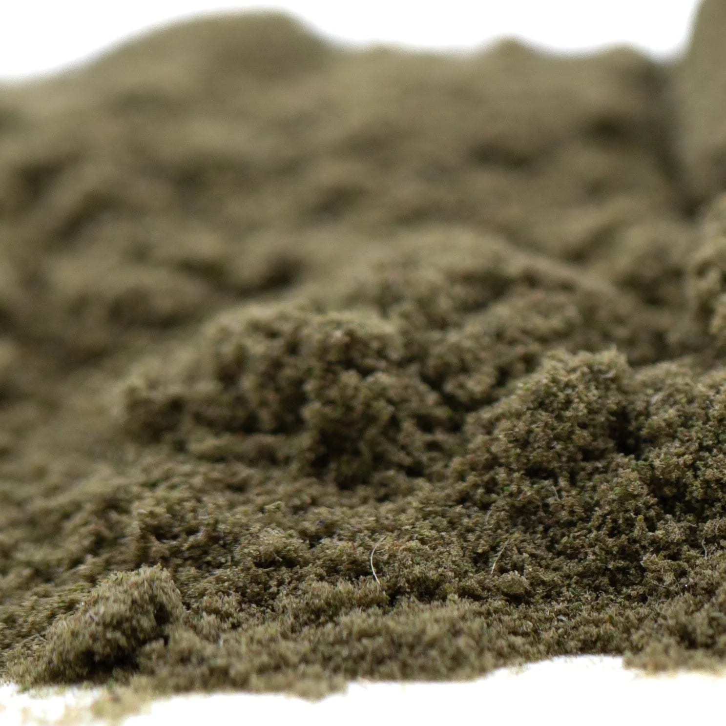 A mound of fine textured mossy green artificial turf representing jelly mints thca kief for sleep support