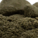 Dense dark green artificial moss with textured fibrous surface for jelly mints thca kief hemp flower product
