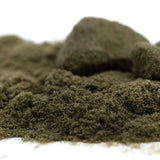A mound of dark olive green jelly mints thca kief hemp flower with a soft textured surface for sleep supporting cbn