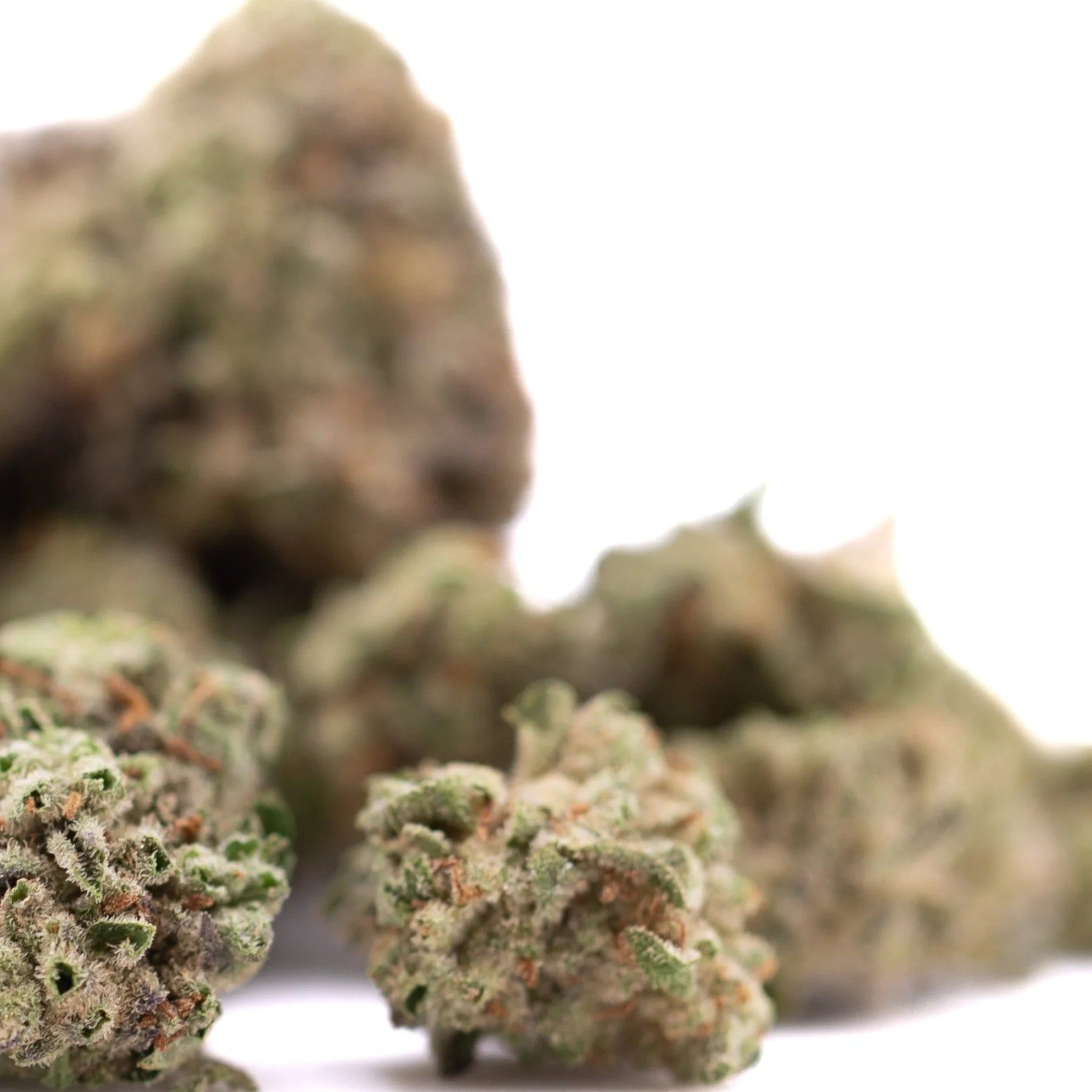 Joker og thca greenhouse smalls wholesale showing green and brown hemp flower buds with frosty texture and laughter-inducing effects