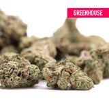 Joker og thca greenhouse smalls with frosty green buds and orange pistils offering laughter-inducing effects and hemp flower benefits
