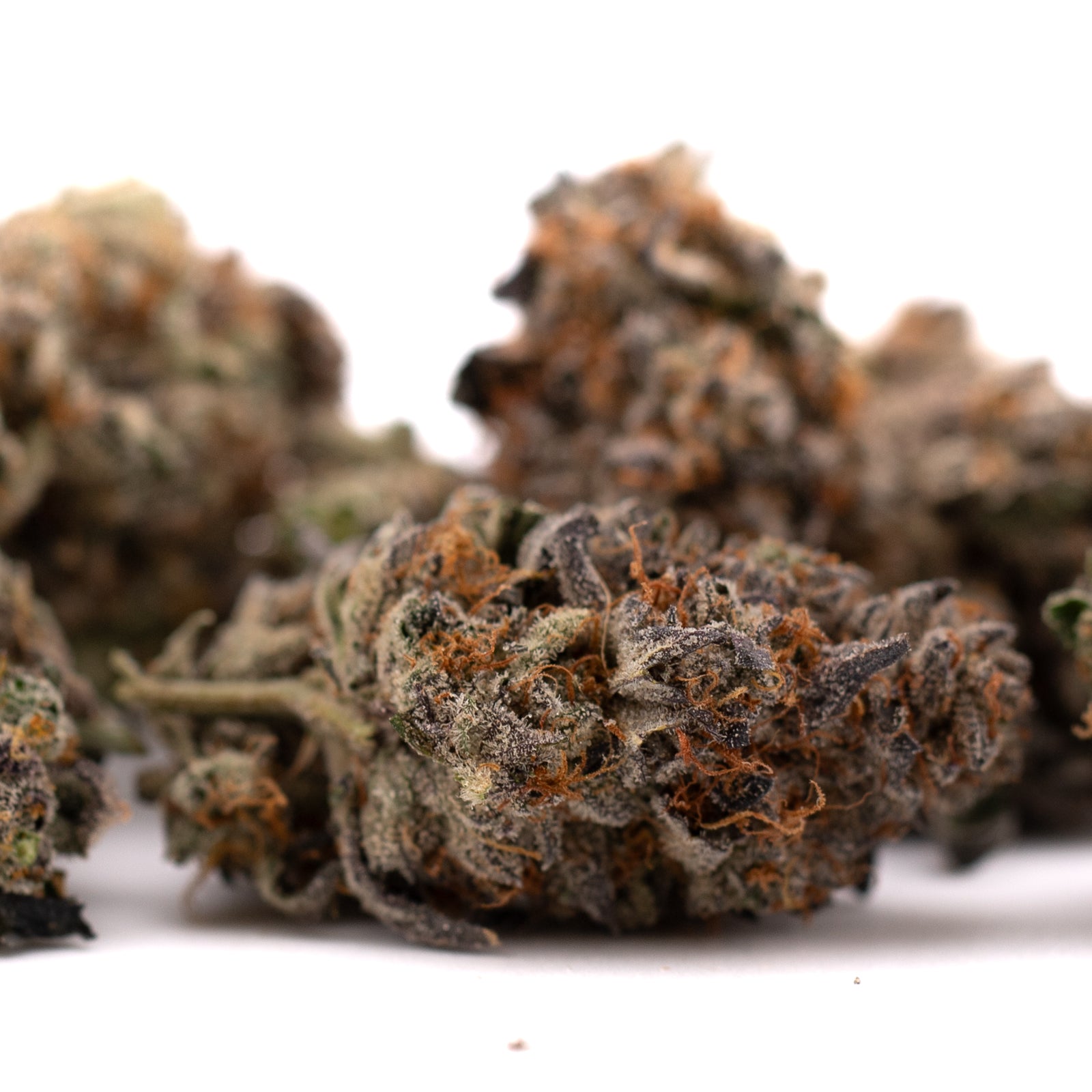 Jokerz NOS hemp flower with dried cannabis buds, orange hairs, and frosty trichomes