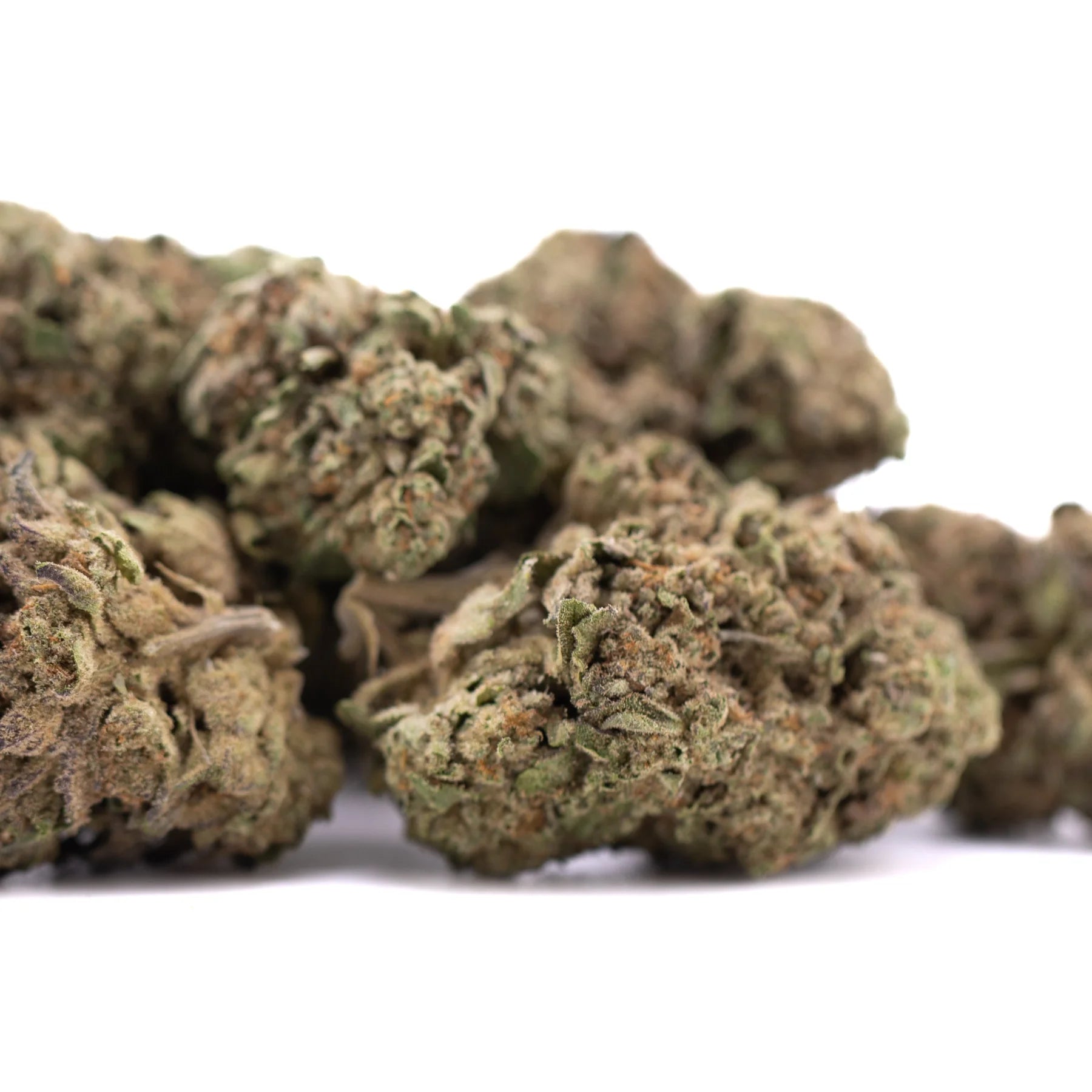 A cluster of dried lemon cherry gelato greenhouse thca flower buds with dense green and brown textured surface