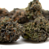 Dark purple cannabis buds with orange hairs and frosty coating from Las Vegas Lemon indoor THCa flower