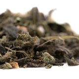 Pile of dried green tea leaves for Lung Buster Indoor Trim Wholesale 1LB with premium THCA