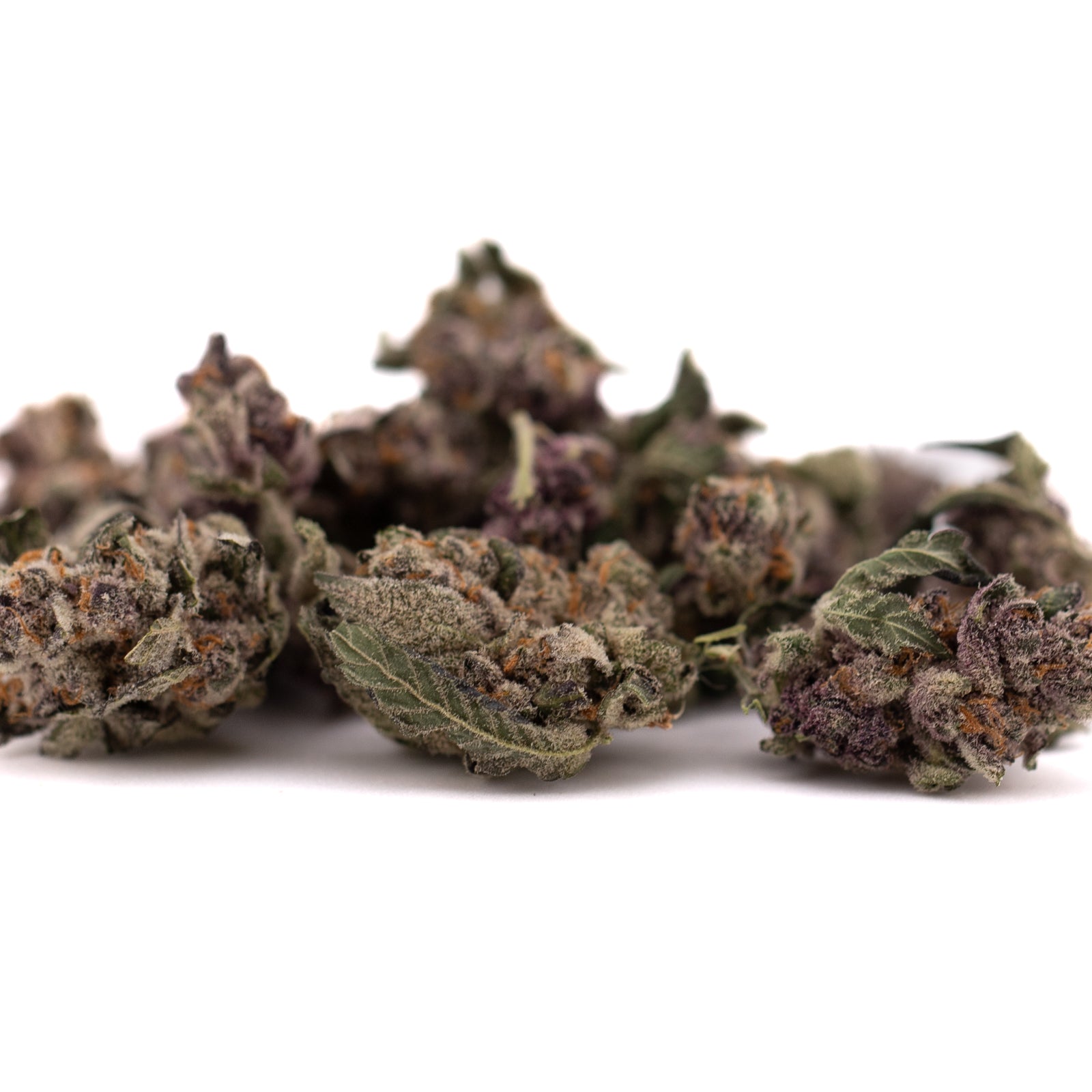 Dried cannabis buds with purple and green hues from Mac And Gary Indoor THCa Flower Smalls