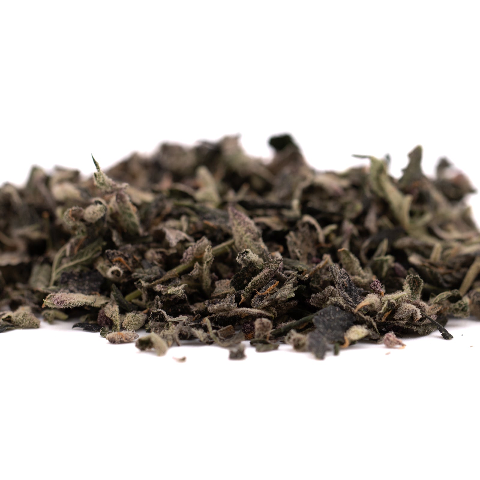 Pile of loose leaf dried tea with thca trim, sugar leaves, and hemp flower for Wholesale 1LB