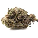 Magik cbd hemp flower full-term dense green and brown cbg hemp flower bud covered in trichomes with textured surface