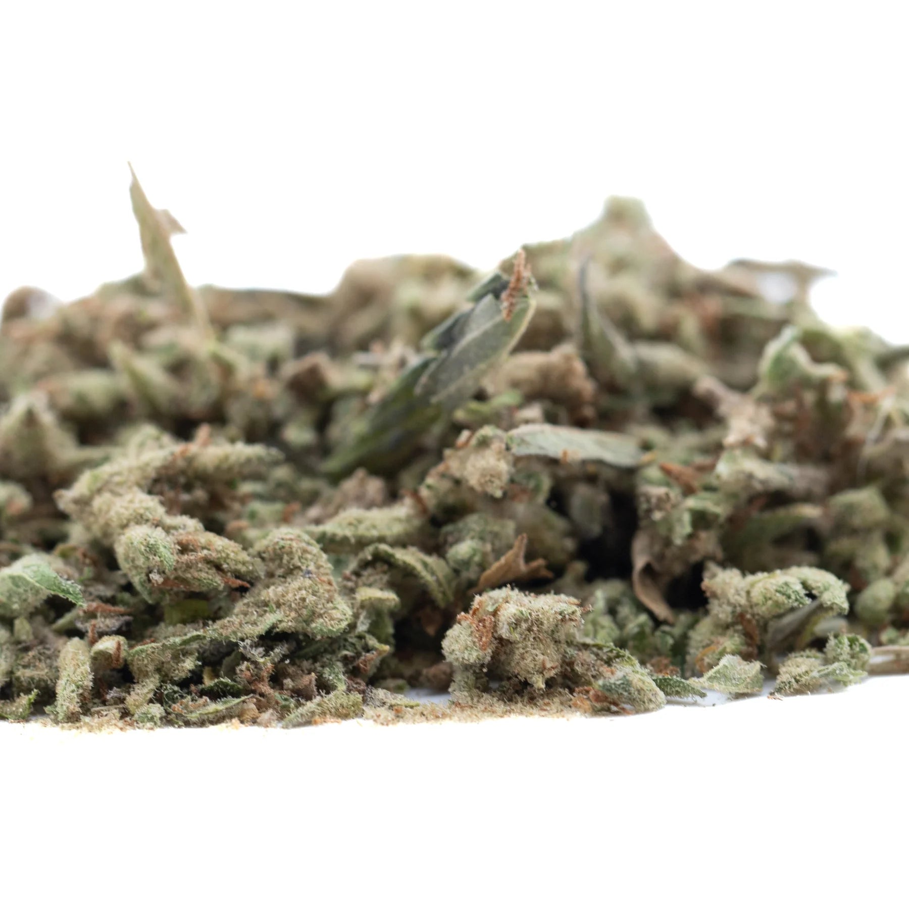A pile of mega gummie bearz thca trim hemp flower buds with green and brown hues covered in white trichomes