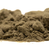 A mound of fine earthy brown thca kief powder for mega gummie bearz enhanced cbd hemp flower wholesale use