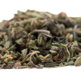 Dried mendo breath thca trim with green and brown herbal leaves and a textured fuzzy surface for vanilla caramel candy