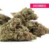 Greenish moroccan peach thca hemp flower with frosty textured surface and brown trichomes in greenhouse wholesale