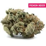 Dense Moroccan Peaches Indoor THCa Flower with trichomes and orange pistils