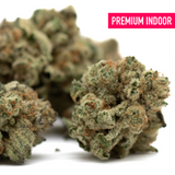 Dense Moroccan Peaches THCa flower with trichomes and orange pistils, premium hemp flower