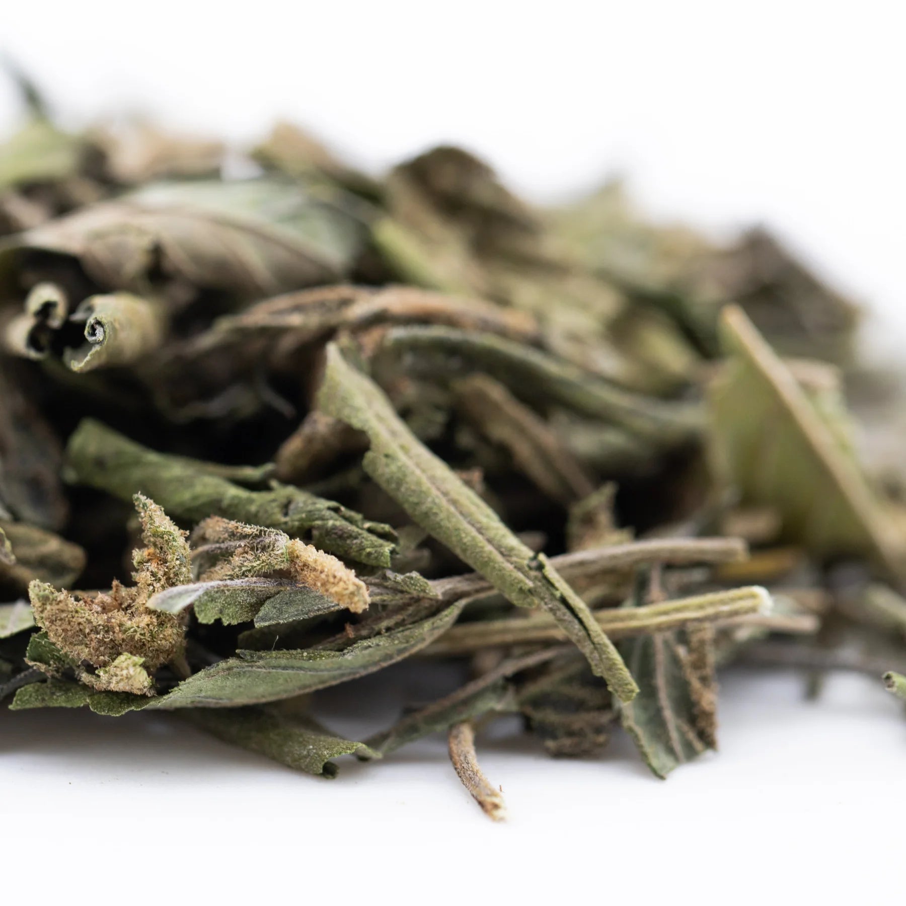 Dried green and brown nascar greenhouse thca trim hemp flower showcasing a rich terpene profile and natural texture
