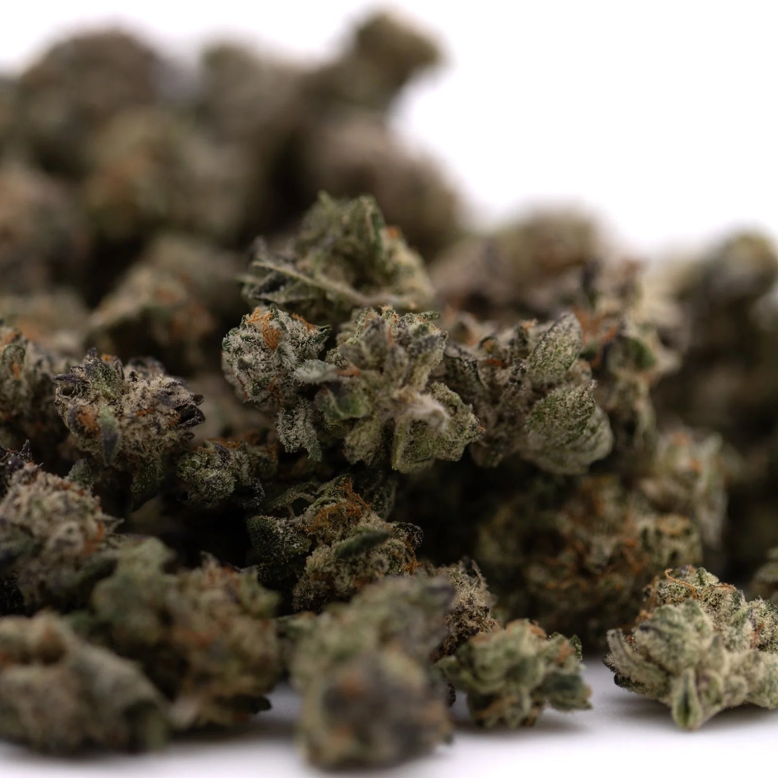 Peach Pie Indoor THCa Hemp Flower Smalls with green buds, orange hairs, and white trichomes